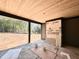 Covered patio with wood ceiling and view of the expansive backyard area at 10 Gambel Dr, Youngsville, NC 27596