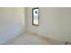 Bright room with a single window, offering potential for a cozy and inviting space at 10 Gambel Dr, Youngsville, NC 27596