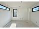 Well-lit room with three windows offering natural light and potential for a welcoming space at 10 Gambel Dr, Youngsville, NC 27596