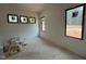 Bright and airy room with multiple windows offering scenic views, ready for customization at 10 Gambel Dr, Youngsville, NC 27596
