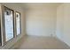 Spacious room with natural light streams through multiple windows, highlighting the blank canvas at 10 Gambel Dr, Youngsville, NC 27596