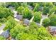An aerial view of the house nestled among lush greenery in a charming neighborhood at 102 Pin Oak Ct, Elon, NC 27244