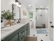 Bathroom with double vanity, modern fixtures, and glass shower at 102 Pin Oak Ct, Elon, NC 27244
