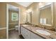 Elegant bathroom featuring double sinks, granite countertops, and plenty of cabinet space at 102 Pin Oak Ct, Elon, NC 27244