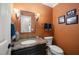 Stylish half bath with granite countertop and modern fixtures at 102 Pin Oak Ct, Elon, NC 27244
