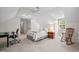 Bright bedroom with a comfortable bed and cozy rocking chair at 102 Pin Oak Ct, Elon, NC 27244