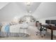 Spacious bedroom featuring high ceilings, built-in shelves, and a dedicated desk area at 102 Pin Oak Ct, Elon, NC 27244