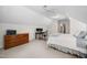 Bedroom with carpet flooring, ceiling fan, dresser and desk at 102 Pin Oak Ct, Elon, NC 27244