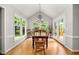 Dining room filled with lots of natural light and views of the deck and backyard at 102 Pin Oak Ct, Elon, NC 27244