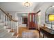Welcoming foyer with an open view to an office and a cozy front porch view at 102 Pin Oak Ct, Elon, NC 27244