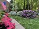 Beautiful landscaped front yard with vibrant azaleas and manicured lawn at 102 Pin Oak Ct, Elon, NC 27244