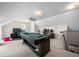 Spacious game room featuring a pool table, television, and comfortable seating at 102 Pin Oak Ct, Elon, NC 27244