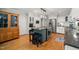 Bright kitchen with island cooktop, stainless appliances, and modern cabinets at 102 Pin Oak Ct, Elon, NC 27244