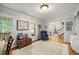 Inviting living room with hardwood floors, area rug, and natural light at 102 Pin Oak Ct, Elon, NC 27244