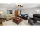 Spacious living room with sofas, coffee table, and decorative accents at 102 Pin Oak Ct, Elon, NC 27244