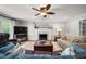 Cozy living room with fireplace, TV, and comfortable seating at 102 Pin Oak Ct, Elon, NC 27244