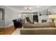 Comfortable living room with fireplace, ceiling fan, and access to backyard at 102 Pin Oak Ct, Elon, NC 27244