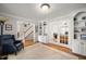 Spacious living room featuring a cozy reading chair and built-in shelves at 102 Pin Oak Ct, Elon, NC 27244