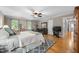 Main bedroom features hardwood floors, natural light, and an en suite bathroom at 102 Pin Oak Ct, Elon, NC 27244
