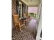 Inviting front porch with rocking chairs, perfect for relaxing and enjoying the outdoors at 102 Pin Oak Ct, Elon, NC 27244
