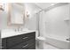 A full bathroom featuring a single sink vanity and shower with white subway tile at 1061 Wirewood Dr # 303, Raleigh, NC 27605