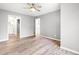 Bright and open bedroom with light walls, modern ceiling fan, and ample closet space, a relaxing retreat at 1061 Wirewood Dr # 303, Raleigh, NC 27605