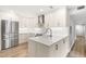 Modern kitchen featuring stainless steel appliances, custom white cabinetry, and a sleek design, perfect for cooking and entertaining at 1061 Wirewood Dr # 303, Raleigh, NC 27605
