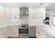 Well-appointed kitchen with stainless steel appliances, white cabinets, and ample counter space for culinary enthusiasts at 1061 Wirewood Dr # 303, Raleigh, NC 27605