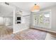 Hardwood floors enhance the open-concept view of the living room and a breakfast room in this home at 1061 Wirewood Dr # 303, Raleigh, NC 27605