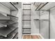 Walk-in closet features custom shelving and organization units at 1061 Wirewood Dr # 303, Raleigh, NC 27605