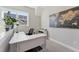 Bright office space with neutral carpet, large window, built-in desk, and world map art at 107 York Dr, Oxford, NC 27565