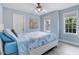 Serene bedroom featuring bright walls, wood flooring, a ceiling fan, and a cozy bed with bright bedding at 1128 Neuse Ridge Dr, Clayton, NC 27527