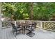 Outdoor deck with a dining table and chairs, perfect for entertaining or enjoying meals al fresco at 1128 Neuse Ridge Dr, Clayton, NC 27527