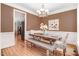 Elegant dining room featuring a modern table, stylish chairs, and bright lighting at 1128 Neuse Ridge Dr, Clayton, NC 27527