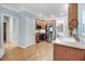 Well-equipped kitchen with stainless appliances, light blue walls and wooden cabinets at 1128 Neuse Ridge Dr, Clayton, NC 27527