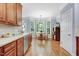 Kitchen with a dining area and ample natural light from surrounding windows at 1128 Neuse Ridge Dr, Clayton, NC 27527