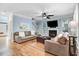 Comfortable living room with a fireplace, hardwood floors, and a staircase at 1128 Neuse Ridge Dr, Clayton, NC 27527