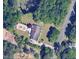 Aerial view of a well-maintained home with lush greenery and mature trees, located on Hatch Rd at 1208 Hatch Rd, Chapel Hill, NC 27516