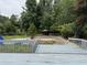Spacious backyard featuring a gazebo and framed by a brick wall at 1208 Hatch Rd, Chapel Hill, NC 27516