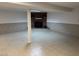 Spacious basement with brick fireplace and tiled flooring at 1208 Hatch Rd, Chapel Hill, NC 27516