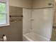 Clean bathroom with tiled walls and bathtub at 1208 Hatch Rd, Chapel Hill, NC 27516