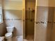 Well-lit bathroom with tile shower and neutral decor at 1208 Hatch Rd, Chapel Hill, NC 27516
