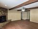 Inviting living room featuring wood-look floors, a decorative fireplace, and wood beams at 1208 Hatch Rd, Chapel Hill, NC 27516