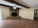 Spacious living room with hardwood floors and stone fireplace at 1208 Hatch Rd, Chapel Hill, NC 27516