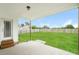 Large backyard featuring a covered patio and a wood fence at 123 Pleasant View Ln, Benson, NC 27504