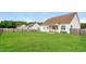 Large backyard featuring a covered patio and a wood fence at 123 Pleasant View Ln, Benson, NC 27504