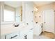 Bright bathroom featuring double sinks, granite counters, and white cabinets at 123 Pleasant View Ln, Benson, NC 27504