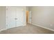 Bedroom featuring neutral paint, carpet, and a closet at 123 Pleasant View Ln, Benson, NC 27504