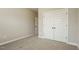 Bedroom featuring neutral paint, carpet, and a closet at 123 Pleasant View Ln, Benson, NC 27504