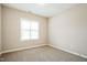 Bedroom featuring neutral paint, carpet, and a bright window at 123 Pleasant View Ln, Benson, NC 27504